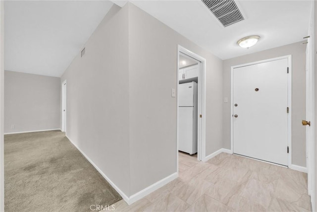 entryway featuring baseboards and visible vents