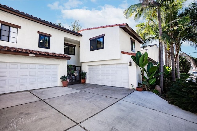 mediterranean / spanish-style house featuring a garage