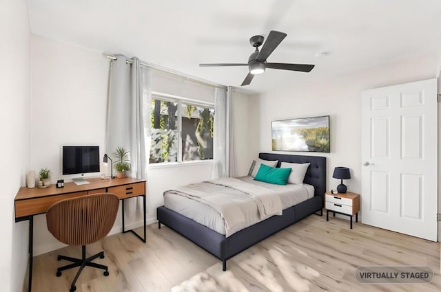 bedroom featuring ceiling fan and light hardwood / wood-style flooring