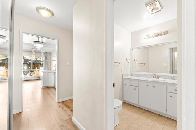 bathroom featuring toilet and vanity