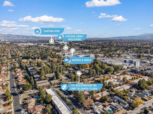 birds eye view of property featuring a mountain view