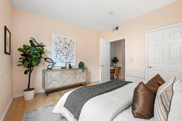 bedroom with light wood-type flooring