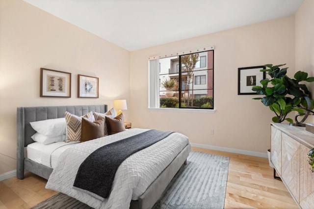 bedroom with light hardwood / wood-style floors