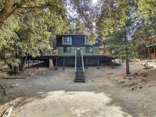 view of front facade with a wooden deck