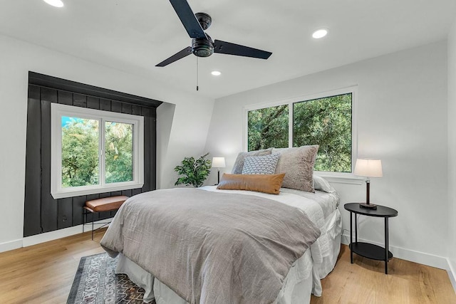 bedroom with light wood-type flooring and ceiling fan