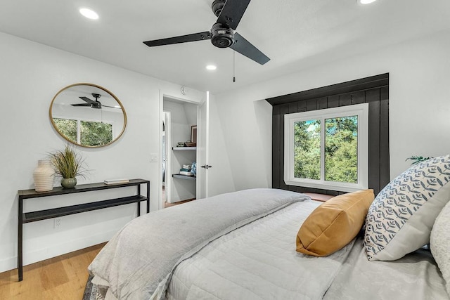 bedroom featuring ceiling fan and wood-type flooring