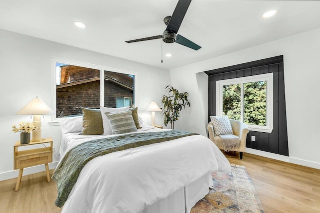 bedroom featuring ceiling fan and light hardwood / wood-style floors