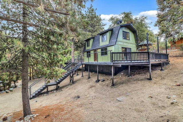 rear view of property with a deck