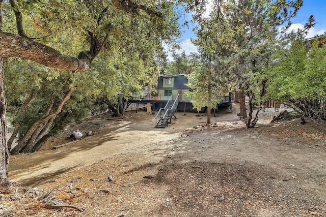 view of front of home featuring a wooden deck