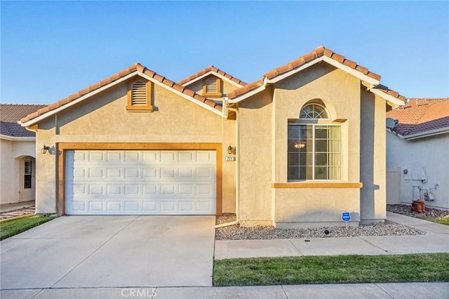 mediterranean / spanish-style home featuring a garage