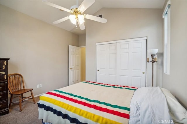 bedroom featuring carpet, ceiling fan, lofted ceiling, and a closet