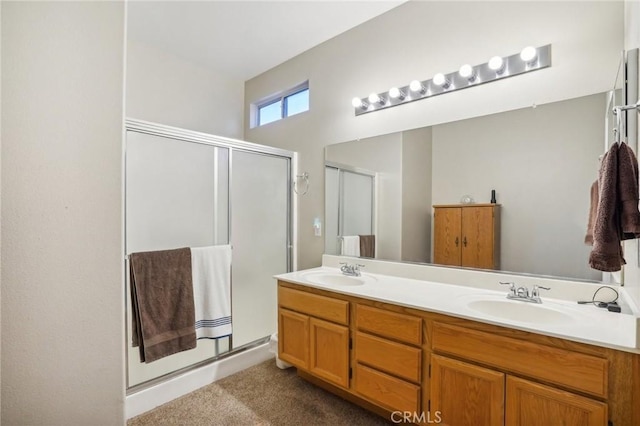 bathroom featuring vanity and a shower with shower door