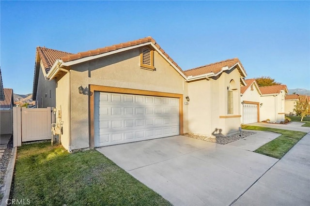 view of front facade with a front yard and a garage