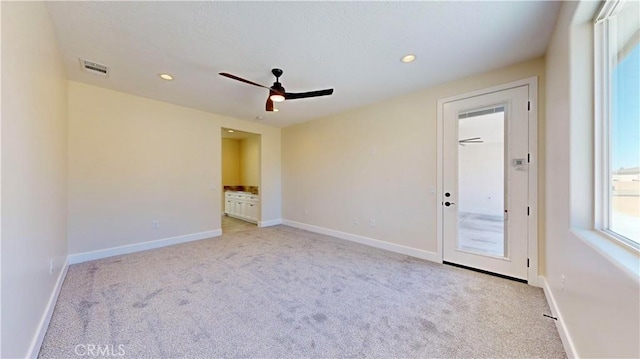 carpeted empty room with ceiling fan