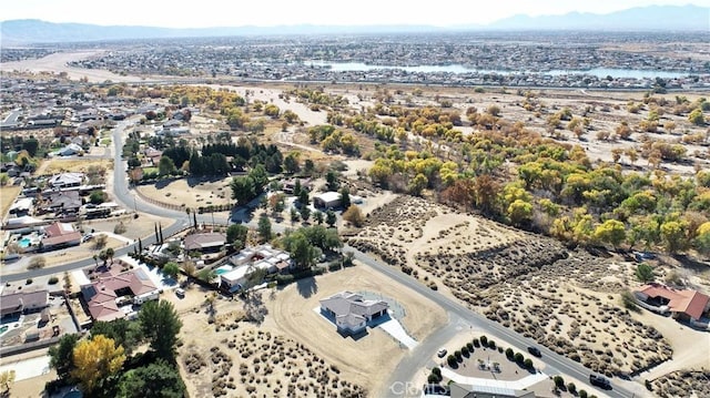 birds eye view of property featuring a mountain view