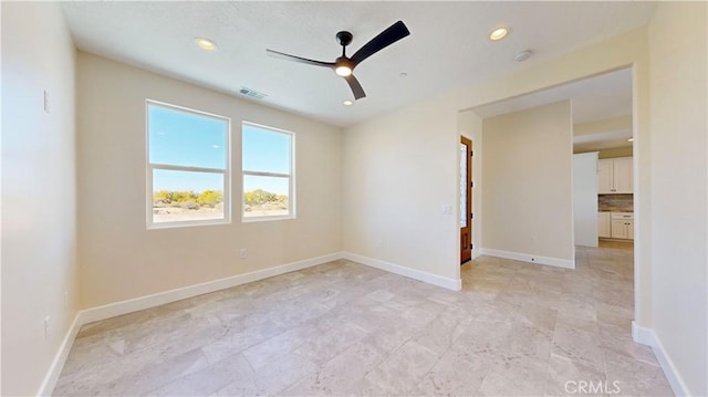 spare room featuring ceiling fan