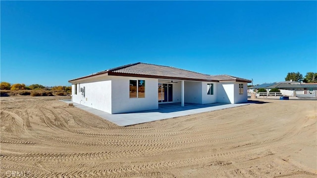 rear view of house featuring a patio