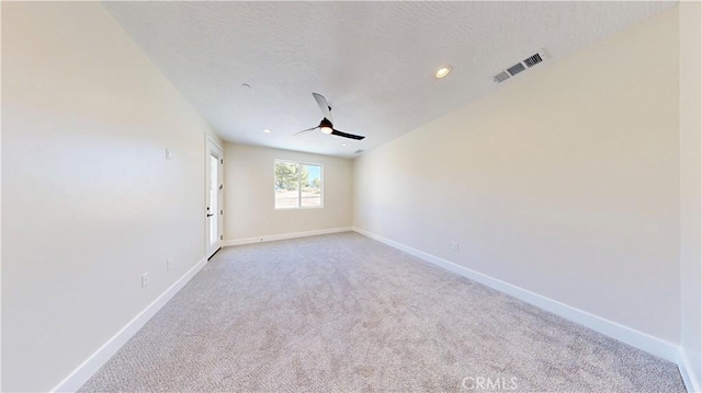 carpeted empty room with ceiling fan