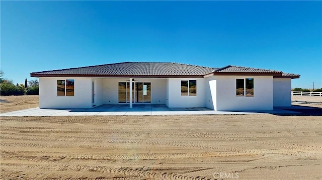 back of house featuring a patio and ceiling fan