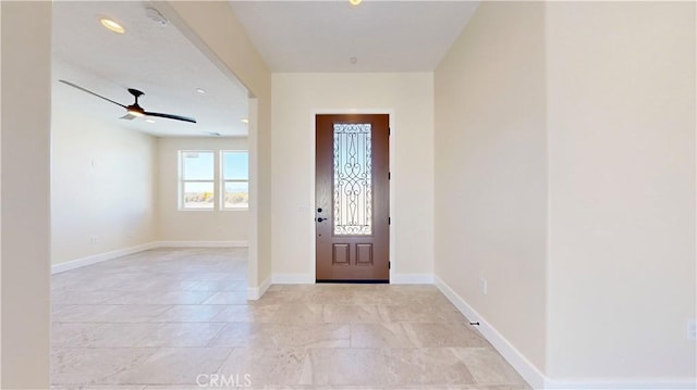 entryway featuring ceiling fan