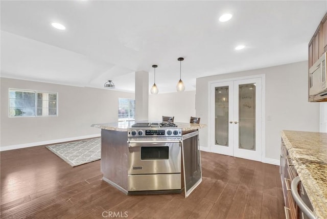 kitchen featuring pendant lighting, light stone countertops, dark hardwood / wood-style flooring, and high end range