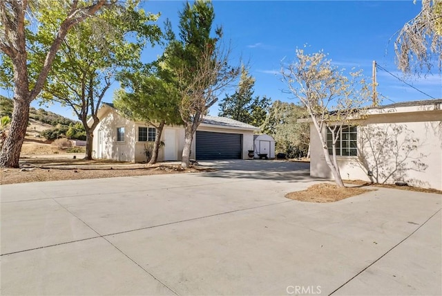 view of side of property featuring a storage shed