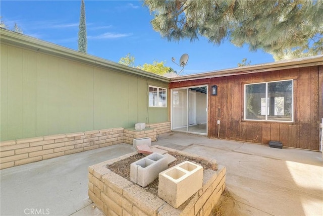 doorway to property featuring a patio area