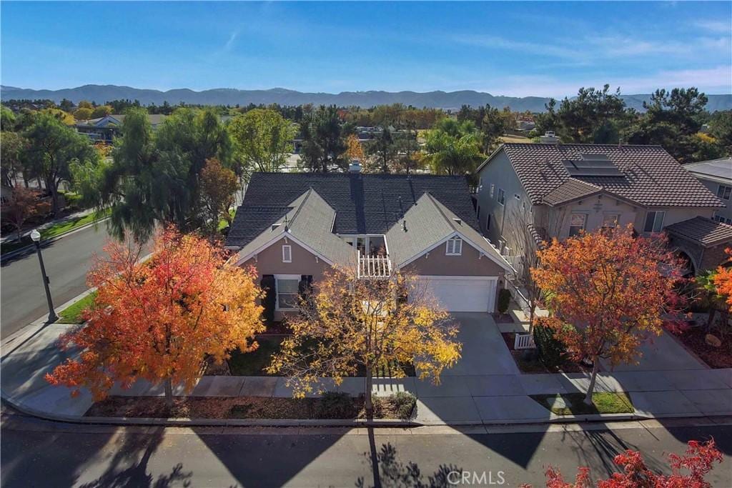 birds eye view of property featuring a mountain view