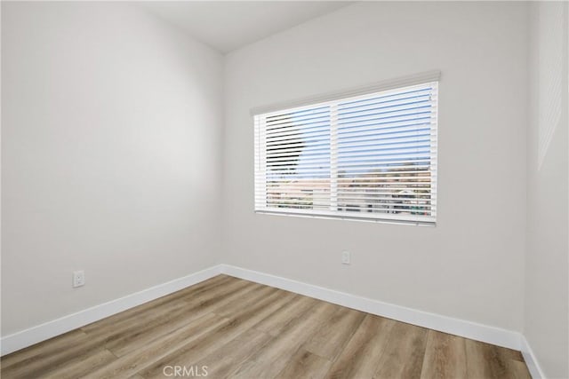 empty room featuring hardwood / wood-style flooring