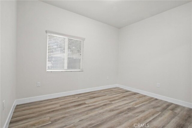 unfurnished room featuring light hardwood / wood-style flooring