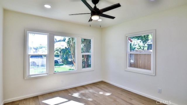 empty room featuring light hardwood / wood-style flooring and ceiling fan