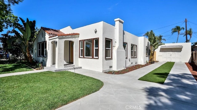 view of front of home featuring a garage and a front yard