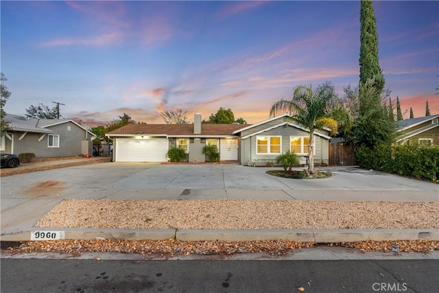 ranch-style home featuring a garage