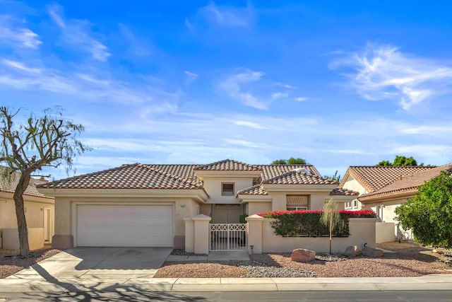 mediterranean / spanish-style home with a garage