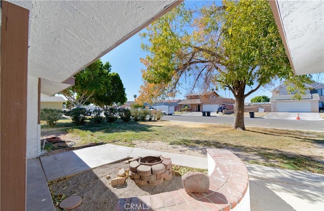 view of patio featuring an outdoor fire pit