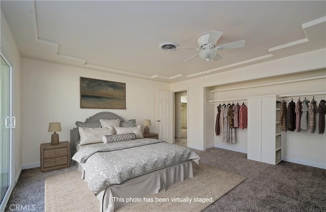 carpeted bedroom featuring ceiling fan and a closet