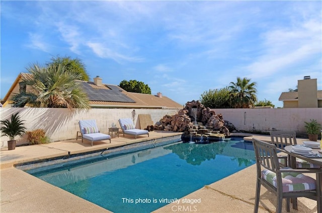 view of pool featuring a patio area