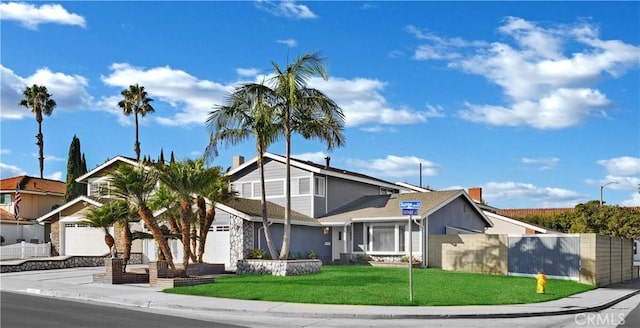 view of front facade with a front lawn and a garage