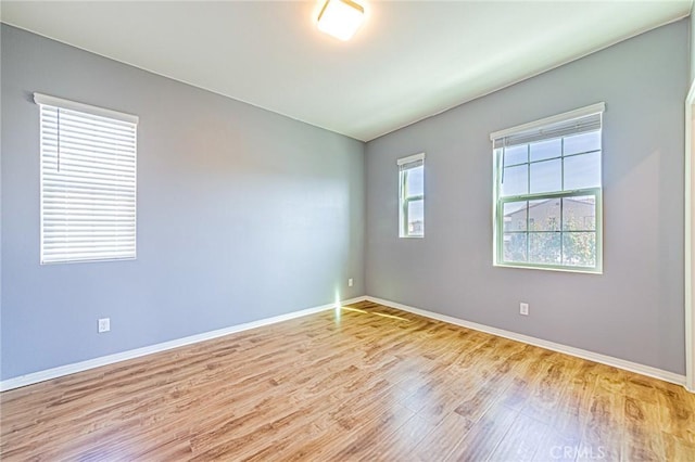 unfurnished room featuring light hardwood / wood-style floors