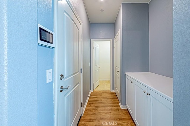 hallway featuring light hardwood / wood-style flooring