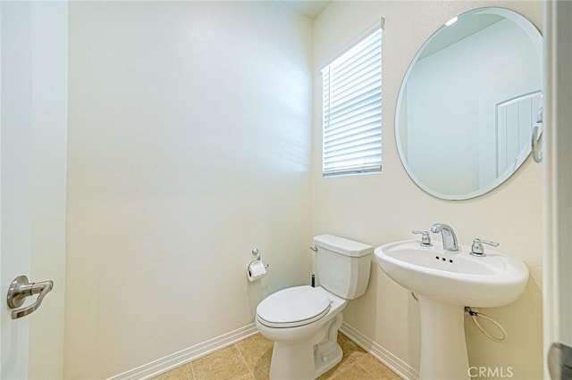 bathroom with tile patterned flooring and toilet