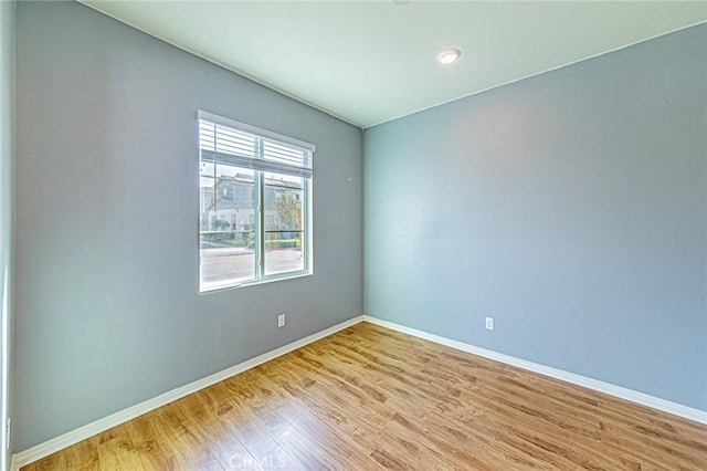 unfurnished room featuring light hardwood / wood-style floors