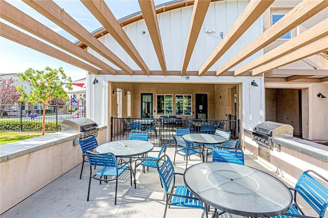 view of patio featuring a pergola and area for grilling