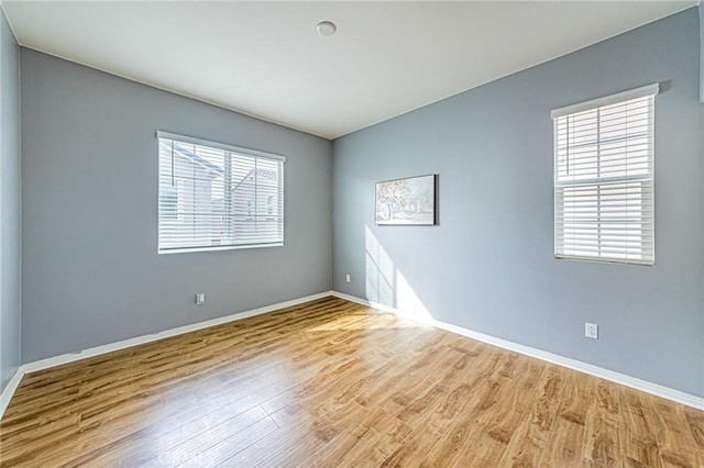 spare room featuring light hardwood / wood-style floors