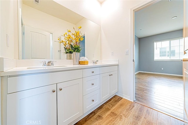 bathroom featuring vanity and hardwood / wood-style floors