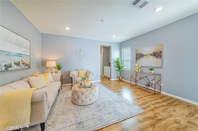 living room with light hardwood / wood-style flooring