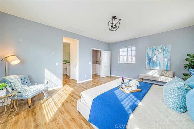 bedroom with hardwood / wood-style flooring