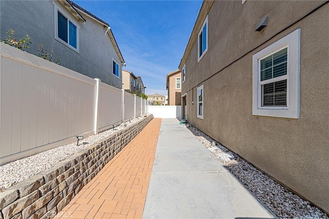 view of side of property featuring a patio