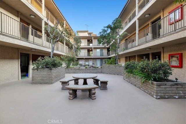 surrounding community featuring a patio area