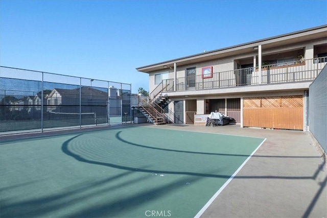 view of sport court featuring tennis court